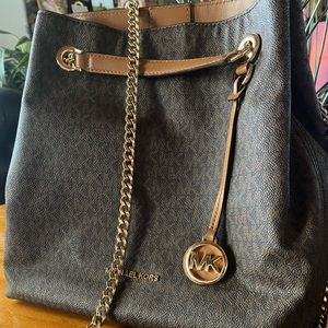 Michael Kors bag. Versatile strap and carry option. Used once or twice.